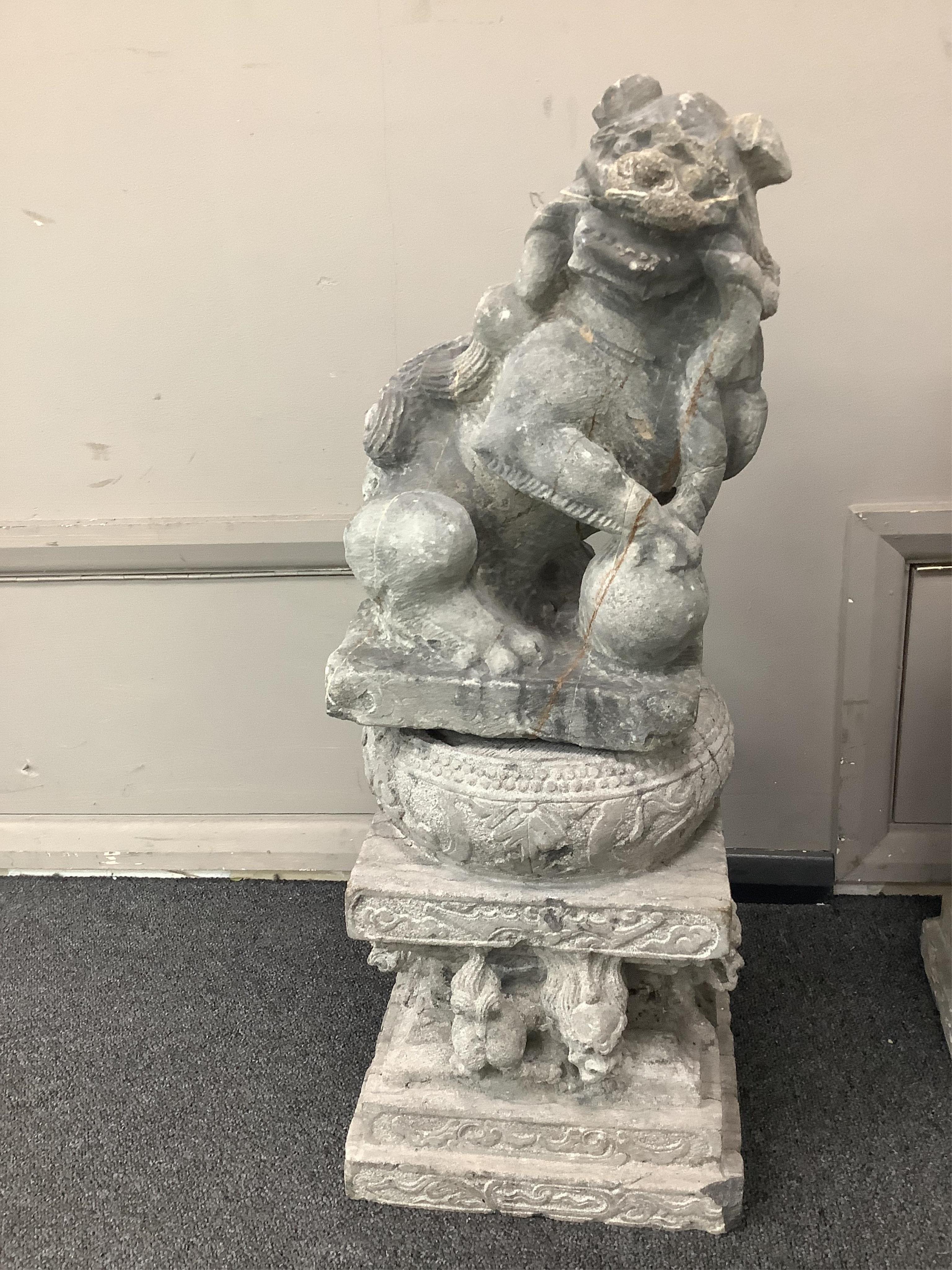 A pair of Chinese limestone supports for columns and a pair of Chinese limestone figures of Buddhistic lions Qing dynasty, 66cm high. Condition - fair